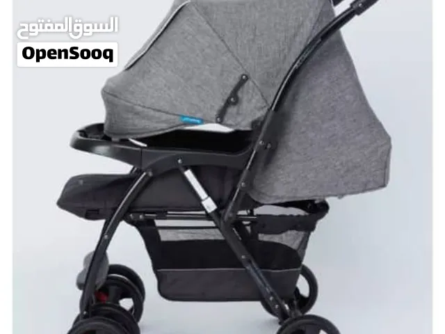 عربة أطفال عملية قابلة للطي بلون رمادي داكن وإطار أسود من علامة جونيورز (Juniors) المتوفرة في المتاج