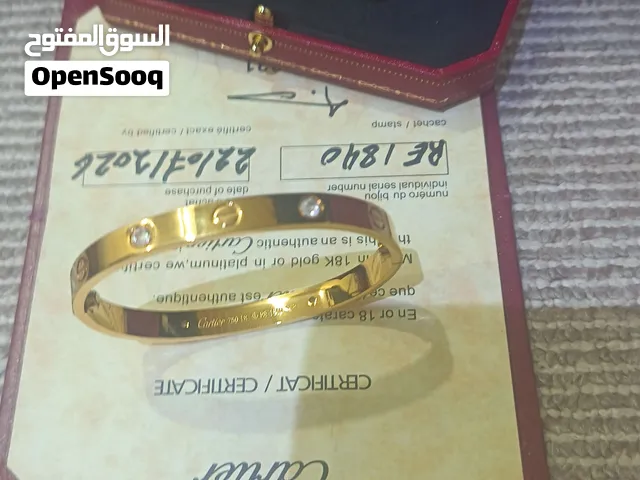 سوارة كارتير نخب اول مطلي ذهب عيار 18 مع خاتم وحلق مع علبهم وشهادات