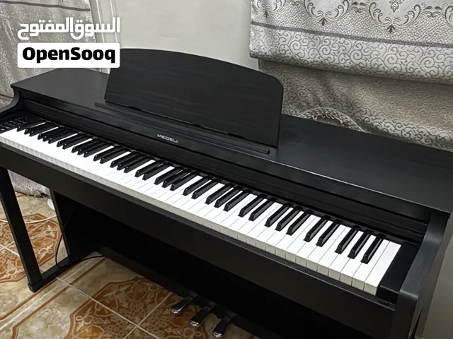 للبيع بيانو medeli up 203