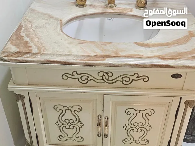 Bathroom Sink with Marble Top Finish.