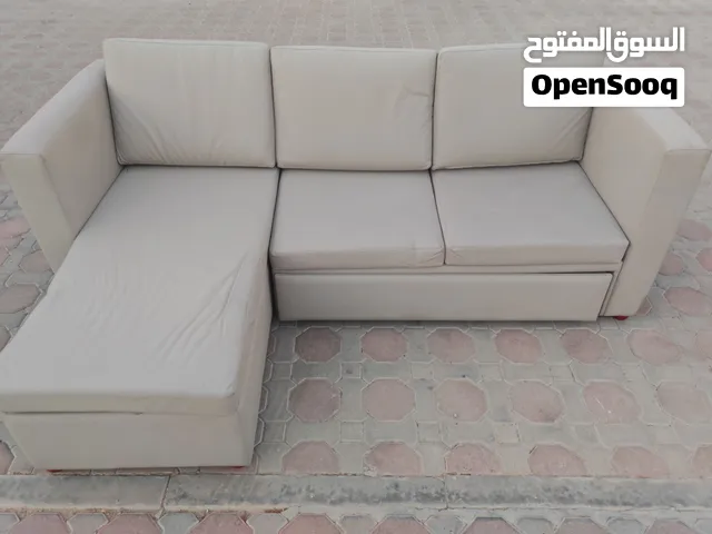 Light beige L-shaped sofa with chaise — good condition