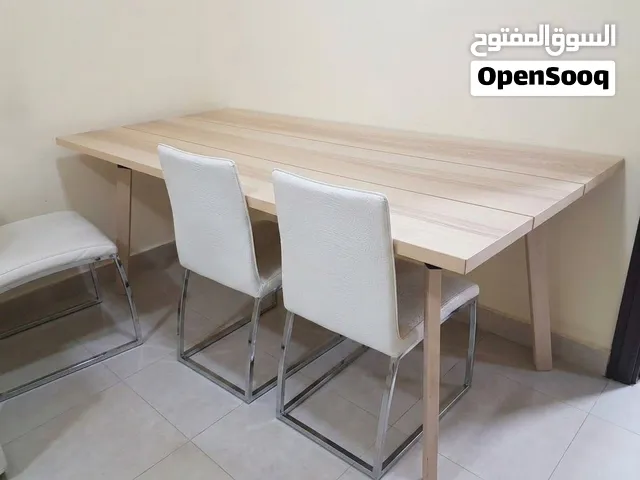Light Wood Dining Table with 6 White Upholstered Chairs - Good Condition