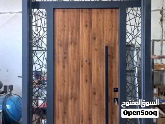 تصنيع كافة الابواب والنوافذ pvc واللمنيوم والحديد الحماية وابواب السحاب والمظلات وغيرها