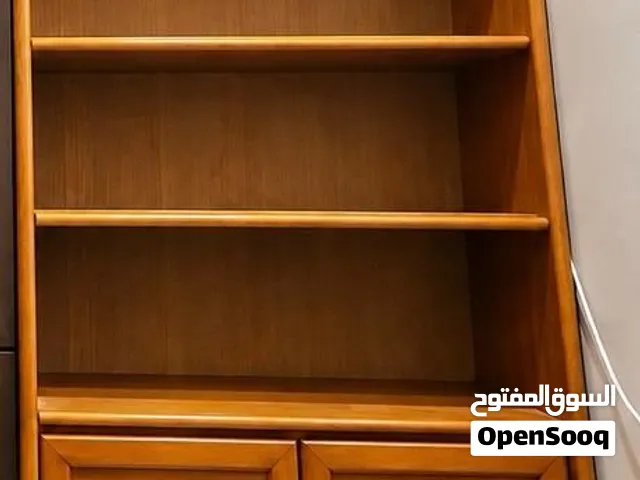 wooden storage tall cabinet with open shelves and doors.