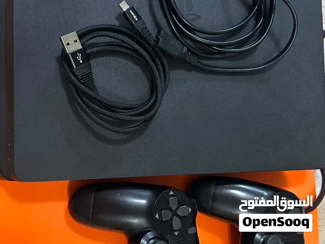 playstation 4 with 2 controllers and games