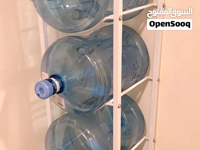 حامل حديدي لعبوات المياه