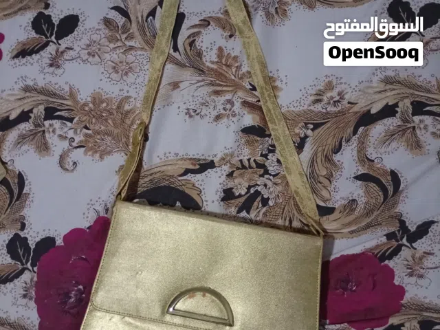 شنطة يد ذهبية ب 50 جنيه