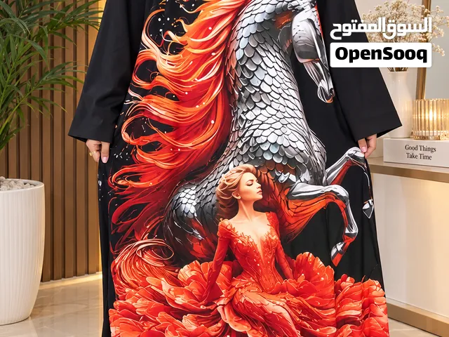 عبايه اسود مع رسمه اورنچ