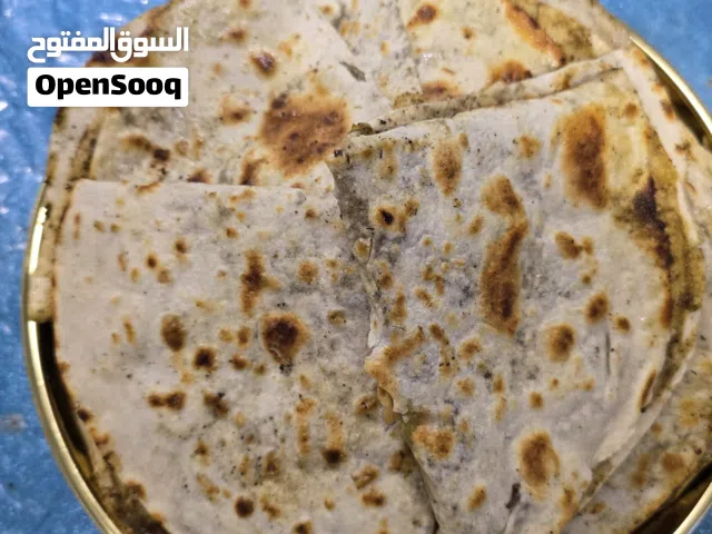 خبز صاج مهياوة بالزبدة او زيت زيتون او دهن عداني مهياوة اجار ثوم يبل مع طماط او بدون طماط كيلو 25حبة