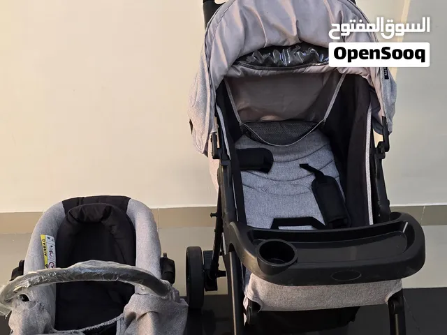 Neatly usedJuniors baby stroller and car seat set for sale in Al khuwair Muscat