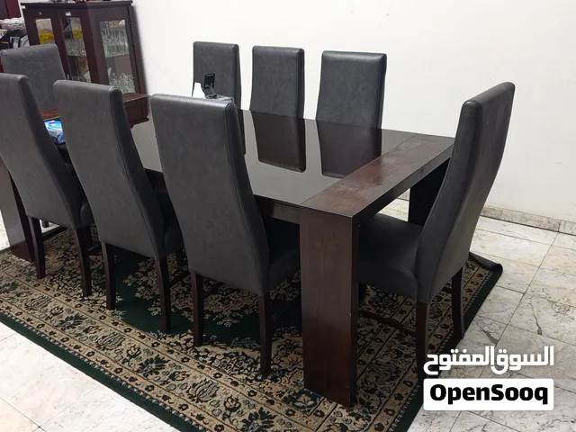 Solid Wood 8-Seater Dining Table with Glass Top and Upholstered Chairs
