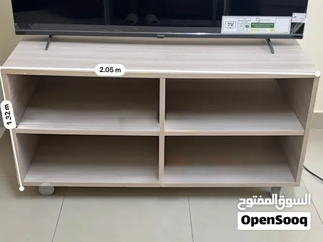Light wood TV stand / entertainment unit with 4 open shelves on both sides and wheels