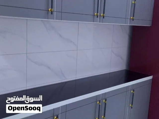 كاونترات خشب مترين ارضي وملحق مع سنك متر وعشرين مرمر 310