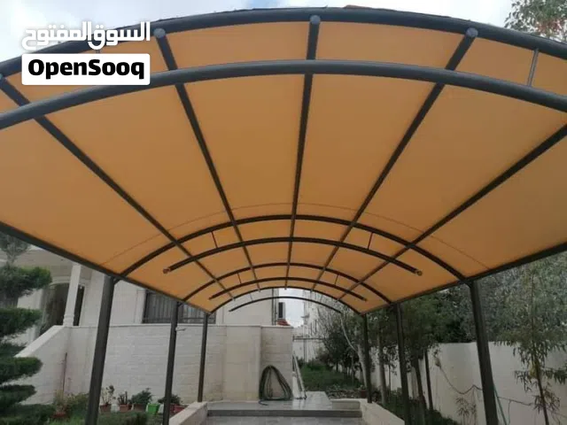 تفصيل مظلات قوسية لكراجات السيارات والساحات الخارجية. توصيل للمحافظات