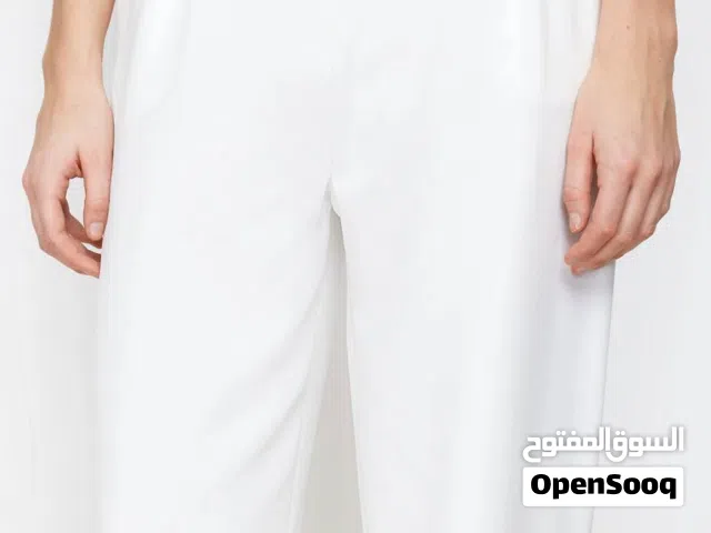 بنطلون أبيض قماش مبطن  ماركة موتف  Motef  قياس لارج ملبوس على كد القياس