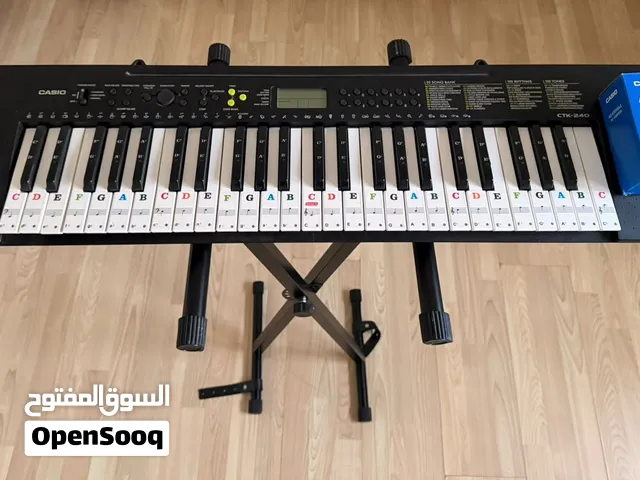 piano casio with his support and charger
