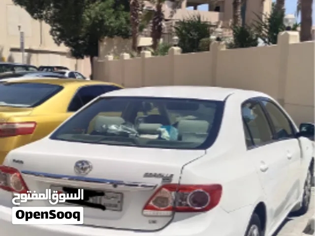Toyota Corolla model 2013 color white- Good in condition for sales