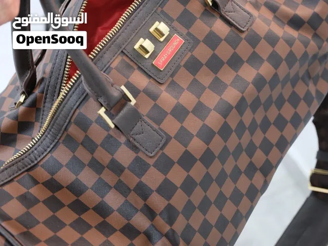 Spray ground duffle اصليه على نقشه لفي، نص سعر الريتيل