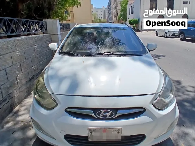 Hundai Accent 2013 white colour 1 year passing and insurance
