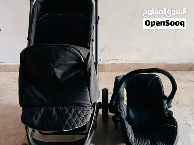 عرباية اطفال للبيع في ابو ظبي مع كرسي سيارة للاطفال