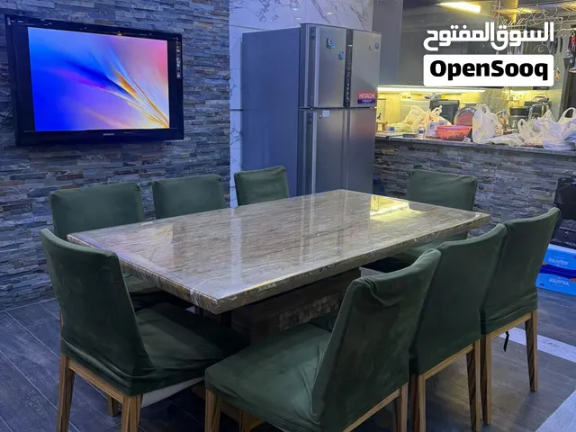 ميز طعام 8 مقاعد و وجه مرمر ثقيل