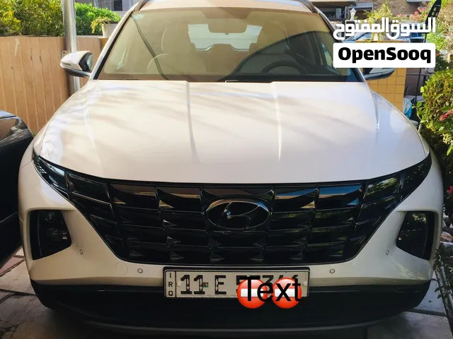 توسان ابيض/موديل 24 /رقم بغداد/ ماشيه 40 نظيفة جدا