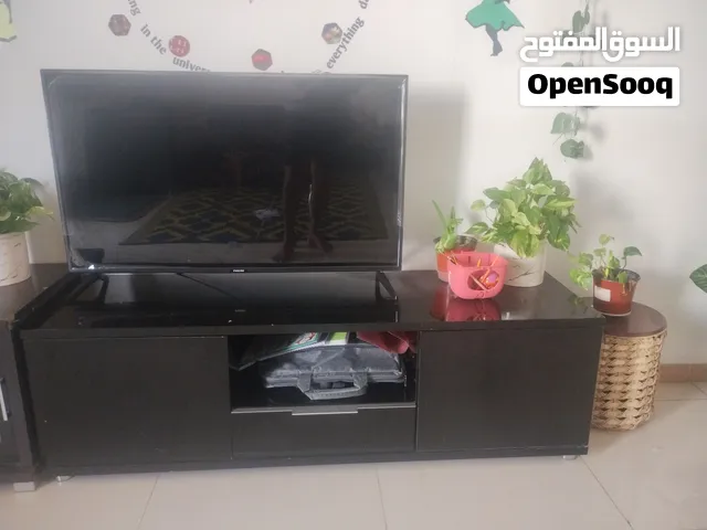 Smart TV 32 inch and TV stand for urgent sale just for OMR 35 , contact me for more enquiry.