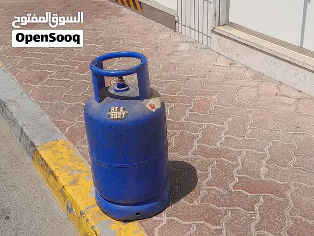 اسطوانة غاز مع منظم وخرطوم