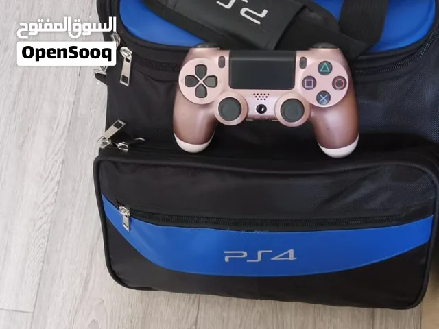 Sony PlayStation 4 with 4 controls and 6 games