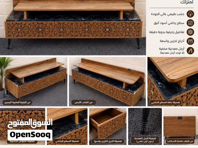 ميز تلفاز انيق خشبي 140 سم بتصميم زخرفي وسطح رخام أسود بحالة جيدة نظيف جداً