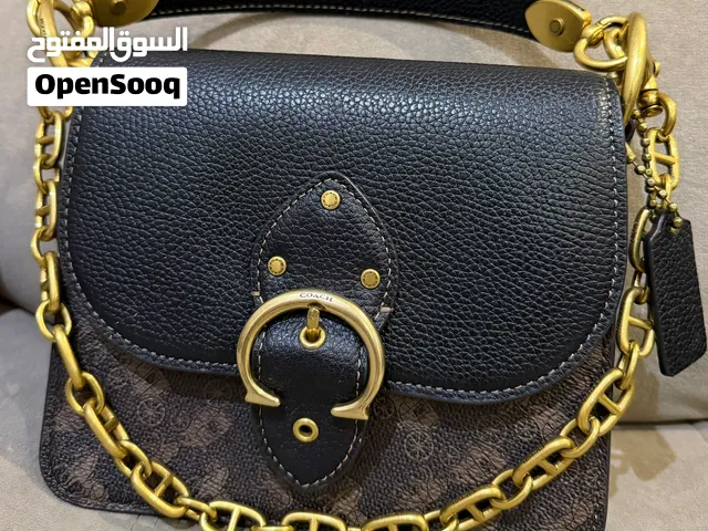 شنطة ماركة كوتش بني مميزة