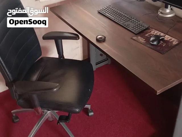 Wooden office table with leather office chair