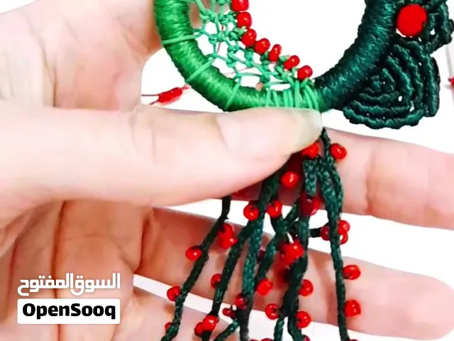 Dreamcatcher and green macrame brooch with red beads and green and gold gems