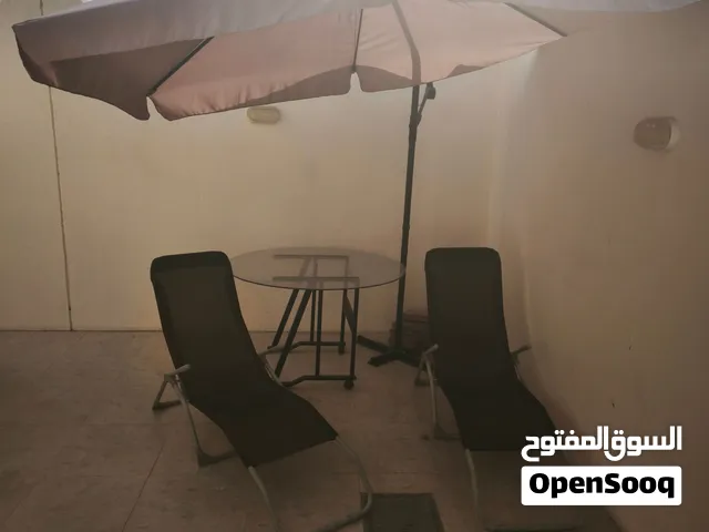 Outdoor furniture set (an umbrella, a table, and two sun loungers)