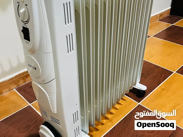 DOTS oil heaters, like-new condition, with original boxes