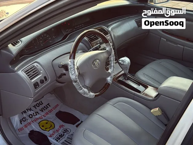 تويوتا أفالون 2003 موديل XLE لون أسمنتي فاخرة مع مميزات حديثة للبيع