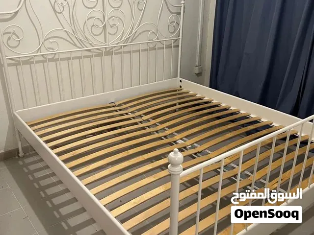 White metal Queen size bed frame with decorative headboard - good condition