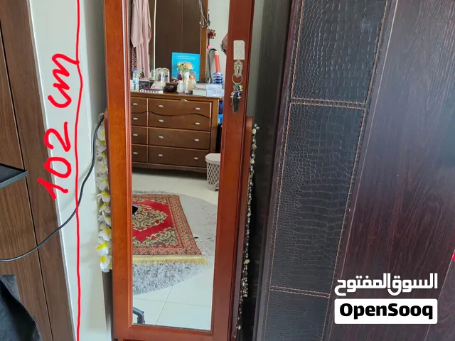 Free-standing full-length mirror with a solid wooden frame