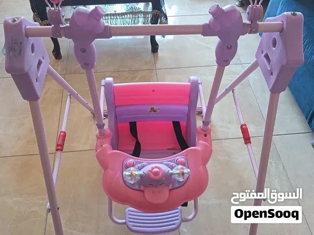 مرجيحه اطفال صغيره ماركه هابي بيبي  لون زهري وبنفسجي للمنزل وللحدائق