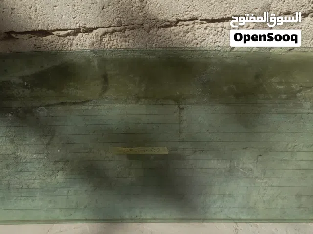 زجاج باص خلفي كيا بستا 92