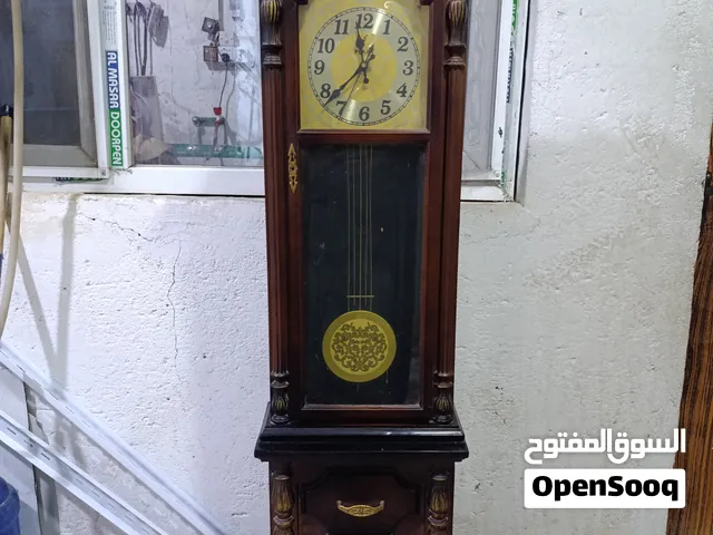 ساعه عموديه ام بندول تشتغل عا بطاريه