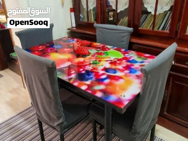 طقم طاولة طعام زجاجية مع 4 كراسي للبيع