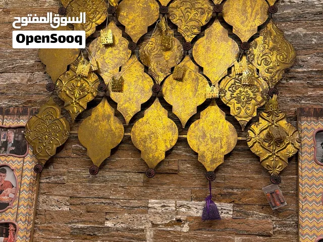 علاق حائط  ذهبي