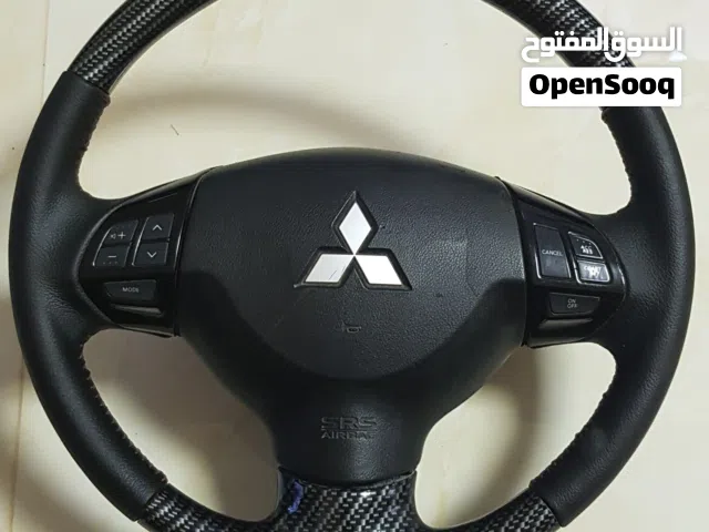 للبيع ستيرنج كاربون اصلي ميتسوبيشي لانسر lancer steering carbon ex gt glx gls