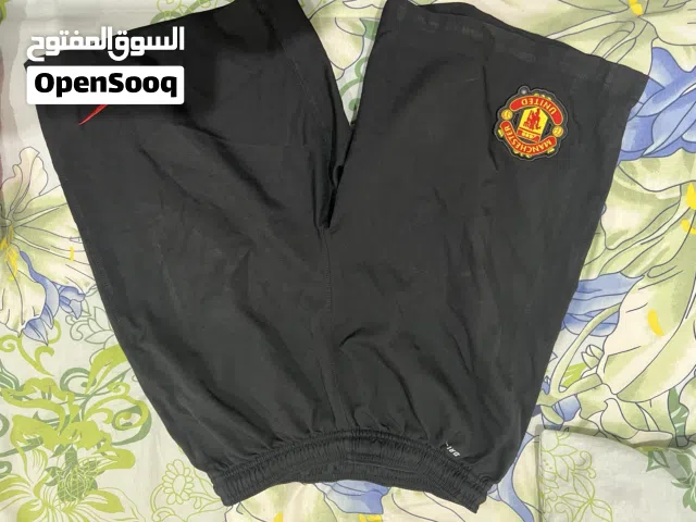 Manchester United Home and away t shirts + shorts