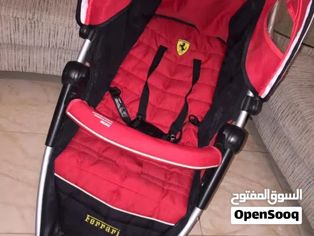 عربة أطفال ماركة فيراري