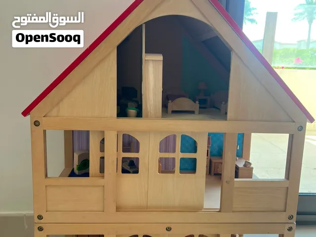 wooden doll house with lots of furniture and toys for girls