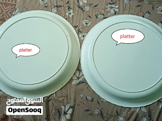 white fluted porcelain or ceramic serving platter or quiche/tart dish with a scalloped edge, similar
