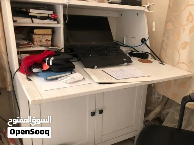 Study Table, IKEA make,  Solid Wood,  with Storage Shelves below.
