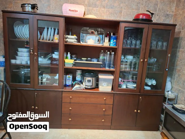 Cabinets 3 nos ,two cabinets with glass doors and the center one with Drawers